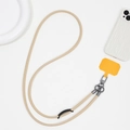 Detail view of durable beige leather crossbody phone lanyard with orange TPU patch - PU Leather Style (K1905)