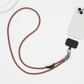 Detail of a brown leather phone lanyard with gunmetal buckle and black tether pad - PU Leather Style (K1906)