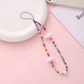 Colorful beaded phone wrist strap with white resin cloud charms and pink background - Rainbow