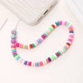 Colorful macaron bead phone strap with floral charms on a white wavy phone case - Polymer Clay Colorful Style