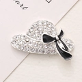Detailed macro view of a silver hat charm with clear crystals and a black enamel bow - Silver Base Black Hat (D1980)