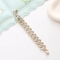 Macro shot of gold Cuban chain phone strap featuring full-set clear rhinestones - Bracelet / Gold Rhinestone Small Square Style (K1744)