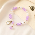 Elegant beaded bracelet with lavender beads, pearls, and heart charm on silk background - Purple Bead Bracelet + Heart (K3508)