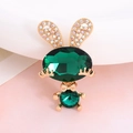 Macro view of golden rabbit charm with emerald green gemstones and sparkling rhinestones - Rhinestone Rabbit (Green)