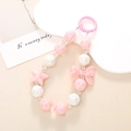 Pink and white beaded phone charm with star and bow motifs on a plastic ring hook - K487 Bow + Five-pointed Star Pendant (pink) / Charm