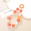Handmade beaded phone strap with orange stars, bows, and roses in vibrant orange white - Bowknot Star Charm Orange (K489)