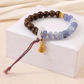 Brown wooden beaded bracelet with purple agate, gold fortune bag charm and colorful tassel - Blue Crystal Zen Wood Style (K4248)