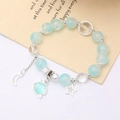 Blue crystal bead bracelet with silver moon, star, and seashell charms for women - Shell Crackle Bead Blue (K4430)
