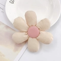 Close-up of a pink padded fabric sunflower accessory for hair clips and DIY crafts - Off White