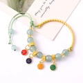 Elegant twisted gold bangle with green beads and colorful lucky charms for women - Ping An Xi Le Beaded Green (K4551)