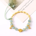 Elegant gold bamboo joint bangle with light green beads and lotus pendant charm - Bamboo Bell Bracelet Green (K4556)