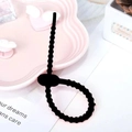 Adjustable black silicone cable tie with textured surface for DIY phone case accessories - Black