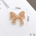 Elegante accessorio a fiocco dorato con perle e strass su un cartoncino bianco - Fiocco traforato (D1795) / Senza Fibbia della Scarpa