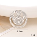 Macro shot of a 2.7cm rhinestone smiley face charm with silver metal base and pearls - Hollow Smile