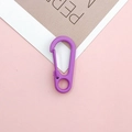 Close-up of bright purple lacquered spring lobster clasp for DIY keychain accessories - Purple