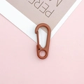 Close-up of a reddish-brown spring lobster clasp with a matte finish for DIY keychains - Brown