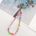 Close-up of colorful clay bead phone charm with LOVE letters, pearls and smiley face - K790 Soft Clay Heart + Smiley Style