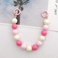 Detailed view of 16mm pink acrylic bead strap with round spring clips for handbags - Hand Chain / Pink Rose and White