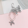 Detail of alloy hollow butterfly pendant with clear crystal beads and a silver clasp - K853 Butterfly Buckle (Two Butterflies)