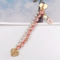 Detail of pink leather woven gold chain with white pearls and heart enamel charms - Pink