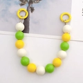 Detail of colorful 16mm acrylic bead strap with yellow, green, and white resin spheres - Hand Chain / Green Yellow and White