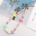 Close-up of handmade beaded phone strap with pearls and colorful acrylic hearts - Multicolor Heart (K854)