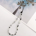 Handmade beaded phone strap featuring black and white acrylic beads with heart and smile patterns - K794 Smile Face and Artificial Pearl