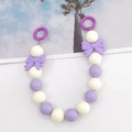 Detail of purple beaded hand strap with acrylic bows and metal spring ring clasps - White + Purple