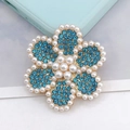 Detailed view of light blue rhinestone flower charm with pearls and gold metal base - Blue Pearl Flower (D1406)