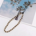 Macro detail of champagne crystal beaded phone strap with faceted square glass beads - Champagne (K1006)