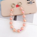 Détail macro de la chaîne de téléphone en perles acryliques roses avec fermoirs en métal - Déstockage (Orange) / Orange (K1026)