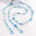 Detail of blue acrylic beaded strap featuring butterfly, bear and heart charms - Blue Series