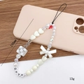 Handmade beaded phone strap with white hearts, pearls, and a happy bow charm - Pearl Heart Bow Phone Chain (K1134)