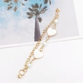 Double-layered golden bracelet with white enamel hearts and pearls featuring a magnetic clasp - Magnetic Model / White