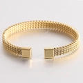 Detail of golden woven mesh texture on stainless steel open cuff bracelet with square ends - Gold