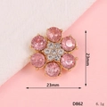 Detail view of a 23mm pink flower pendant with gold plating and crystal accents - D862 Six Large Diamonds / Pink