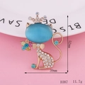 Macro detail of a cat brooch with blue opal head and crown on pink background - Blue Crown Cat Brooch (D387)