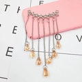 Detail view of silver tassel charm with champagne teardrop crystals for phone cases - Champagne Gemstone Tassel Style (D437)