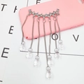 Detail of rhinestone tassel pendant with teardrop crystals for DIY phone case accessories - White Gemstone Tassel Style (D438)