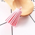 Macro close-up of pink faux suede tassel with hanging loop for DIY jewelry crafts - Pink