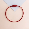 Macro detail of red coated steel wire keychain ring with screw locking connector - Red