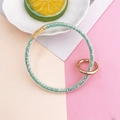 Dettaglio anello glitter verde menta con connettore in metallo a forma di cuore - Verde Lago