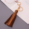 Portachiavi con nappa in pelle marrone con chiusura a moschettone dorata e anello - Testa d'Oro / Oro Scuro
