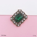 Macro detail of vintage emerald jewel accessory with white rhinestones and pearls - Green Oval Style (D1956)