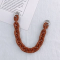 Macro detail of amber acrylic replacement chain with silver metal open rings - Hand Chain / 27.5cm / Brown