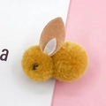 Detail of yellow plush rabbit charm with soft pom-pom texture and felt ears for DIY crafts - Yellow