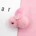 Macro shot of cute pink plush rabbit charm for DIY phone cases and hair accessories - Pink