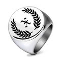 Macro detail of silver stainless steel signet ring with laurel wreath and engraved X - Letter X