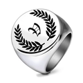 Macro detail of vintage stainless steel signet ring with gothic letter W and laurel leaves - Letter V