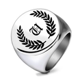 Detail of laser engraved laurel wreath and gothic letter A on silver stainless steel ring - Letter U